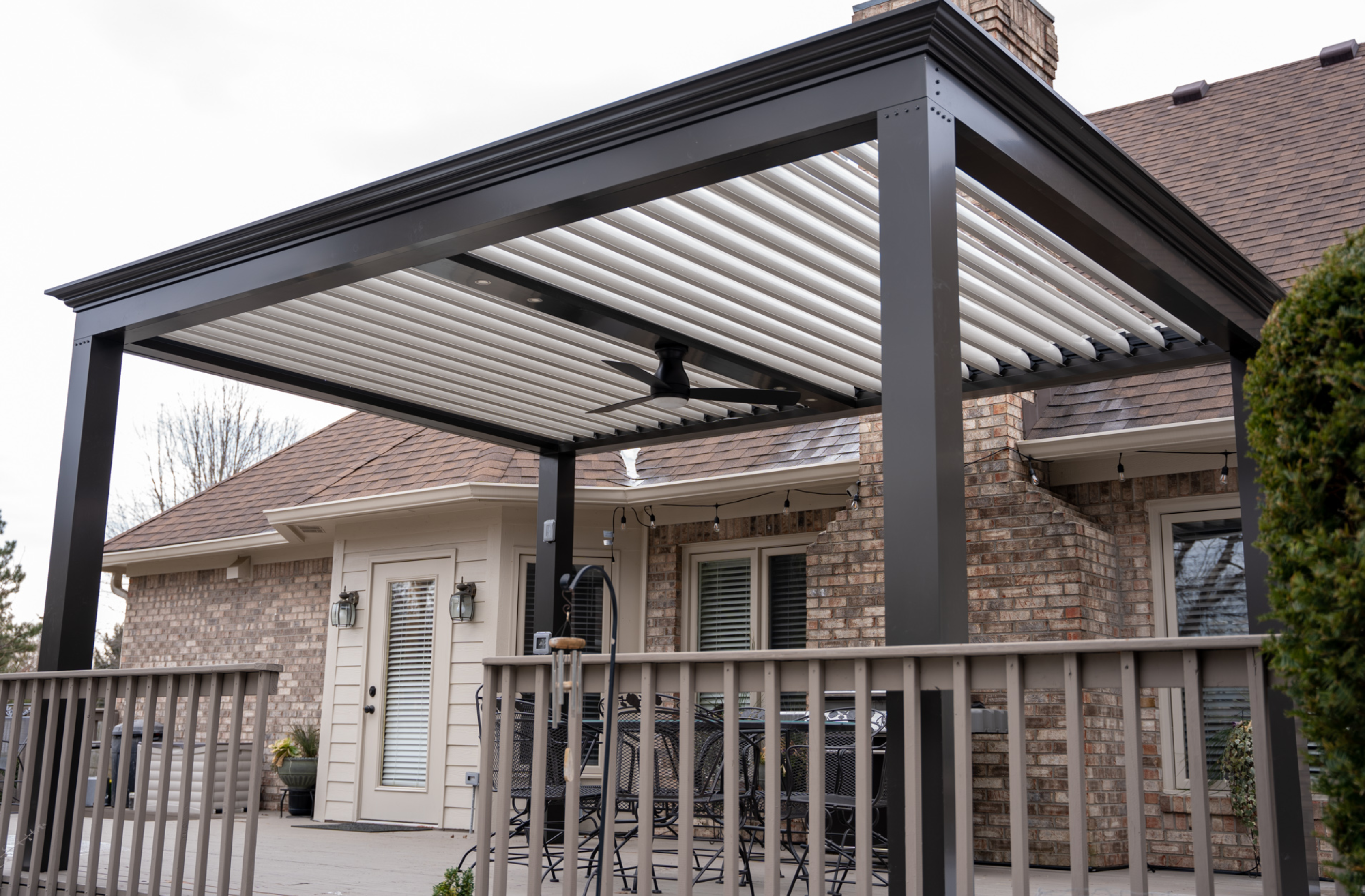 free standing luxury pergola with louvered roof on deck