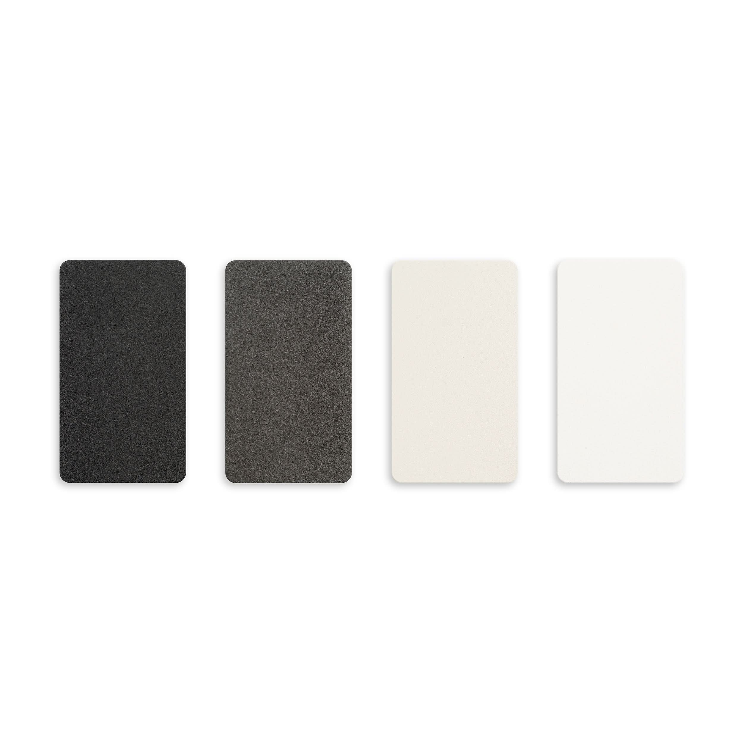 Four color swatches in black, gray, white on a white background