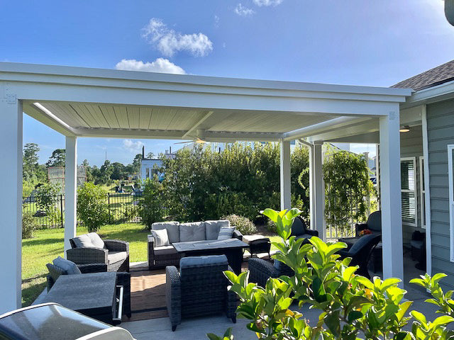 outdoor living room with white aluminum louvered roof pergola structure