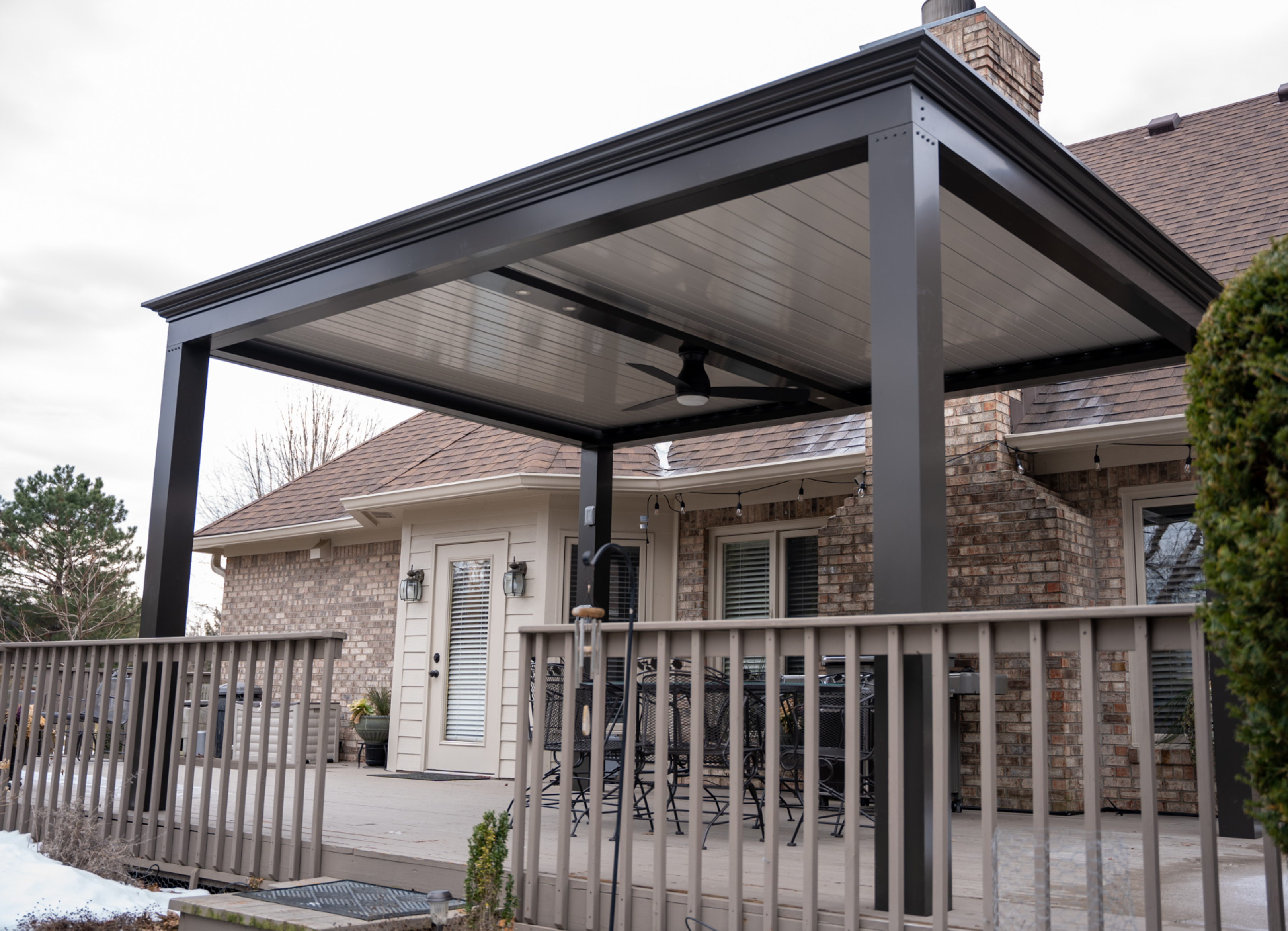 free standing luxury pergola with louvered roof on deck