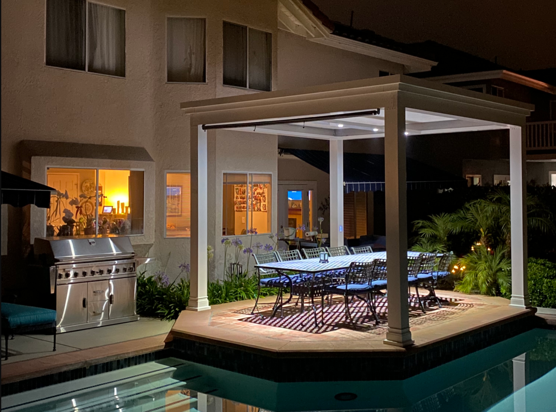 free standing luxury pergola with louvered roof on a poolside pergola