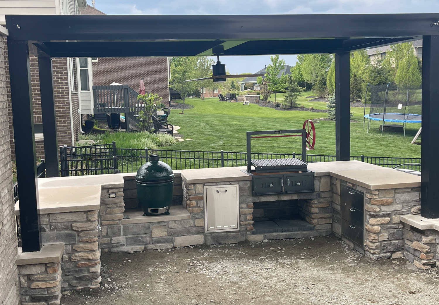 free standing luxury pergola with louvered roof with outdoor kitchen