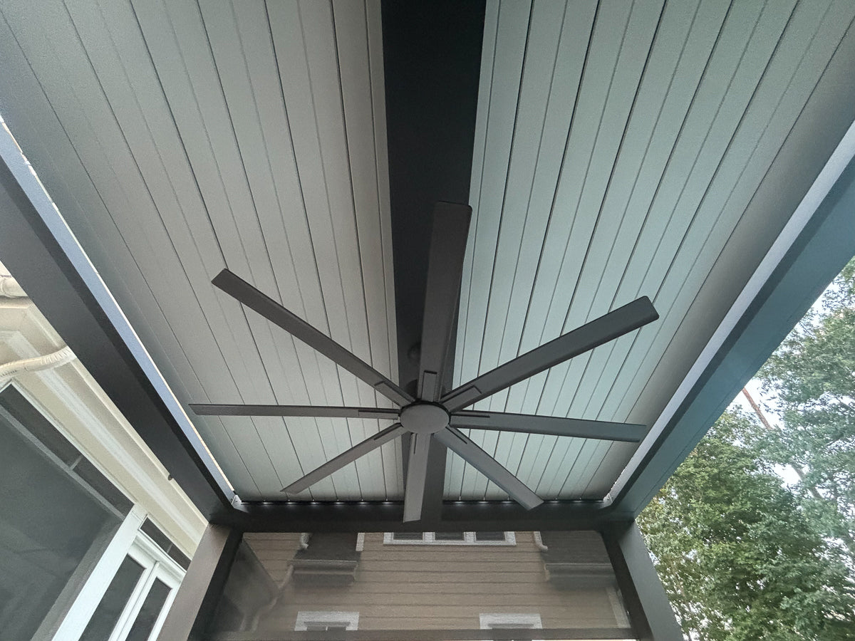 free standing luxury pergola with louvered roof with center beam mounted fan