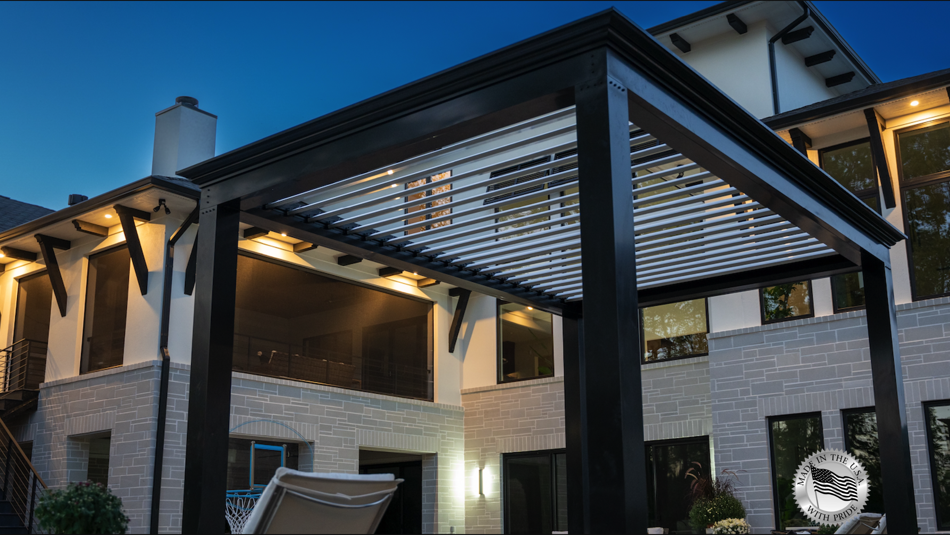 outdoor living apce with free standing luxury louvered pergola structure