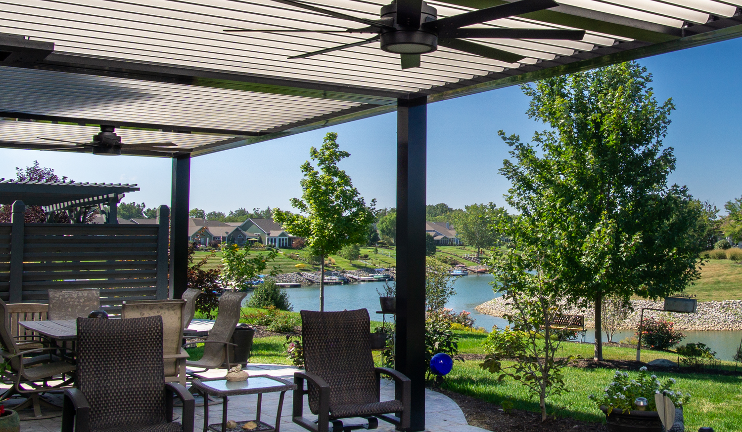 super pergola house attached with two fans outdoor living space on the water