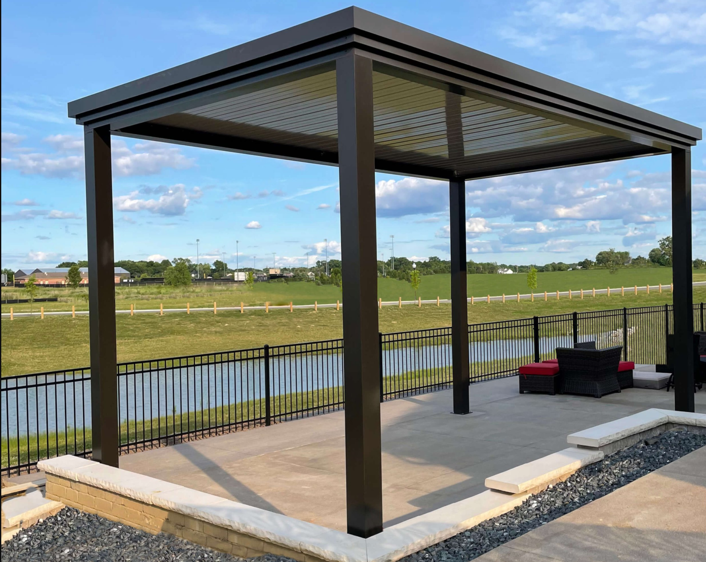 free standing luxury pergola with louvered roof on the water