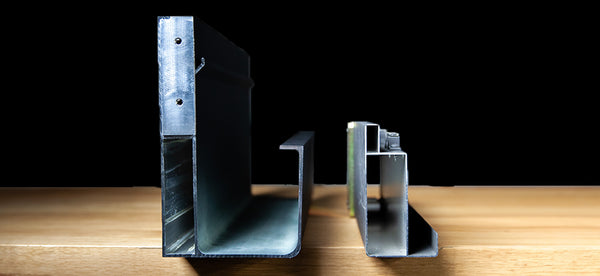 Aluminum post base and corner brackets on wooden table