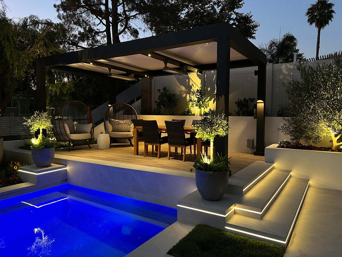 Modern pergola over pool area with evening lighting and architectural design
