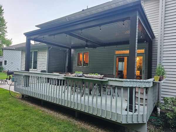 Dark gray pergola on raised deck — Ohio install